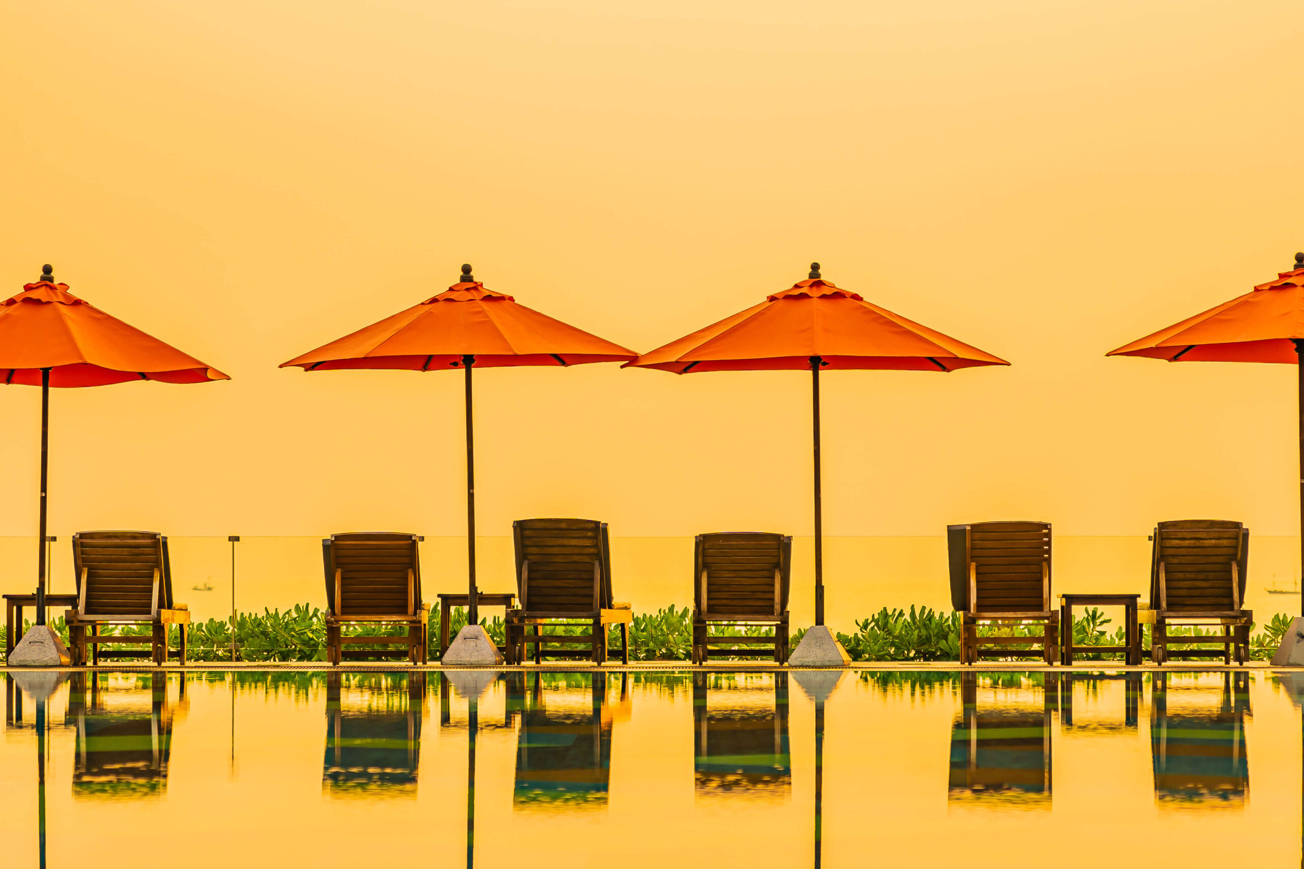 beautiful sunrise around with umbrella chair outdoor swimming pool