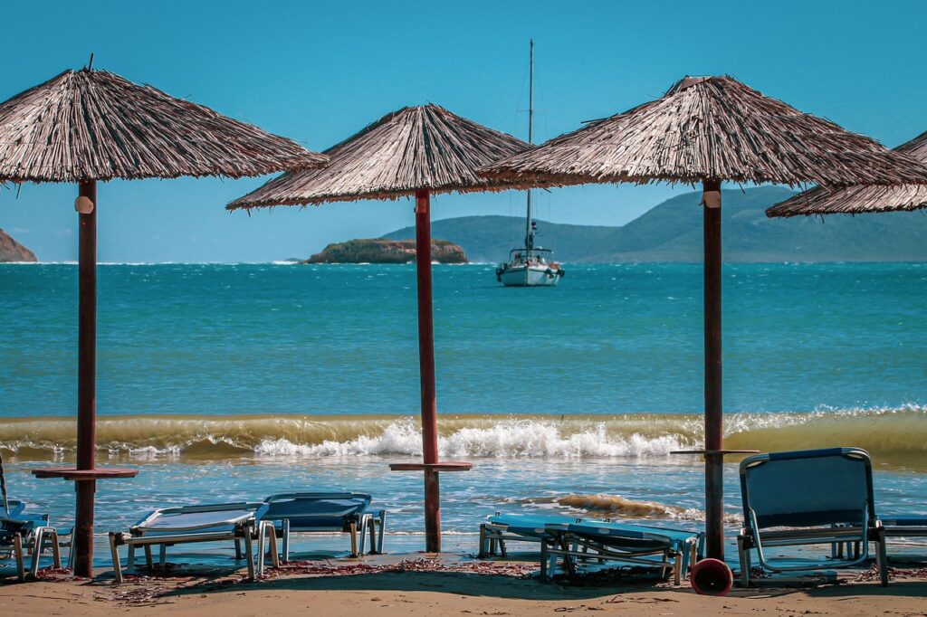 sea, beach, vacations, water, heaven, sand, landscape, sailboat, blue, tropical, umbrella, sun lounger, tourism, nature, to travel, empty, wave, sunshine