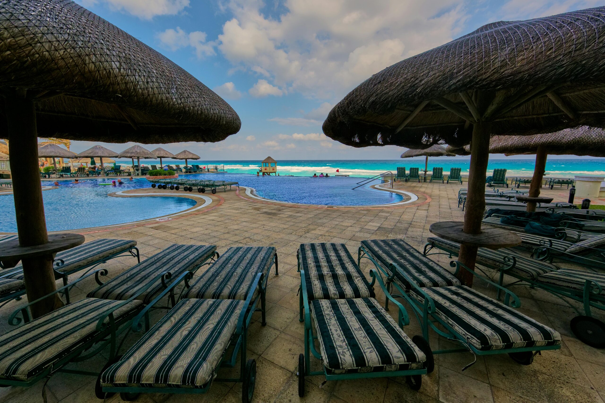 Relax by the resort pool with ocean view at Soledad de Graciano Sánchez in Mexico.